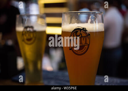 Two glasses of beer at the microbrewery Toit in Bangalore, India. Stock Photo