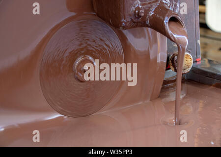 liquid chocolate in a chocolate artisan shop Stock Photo
