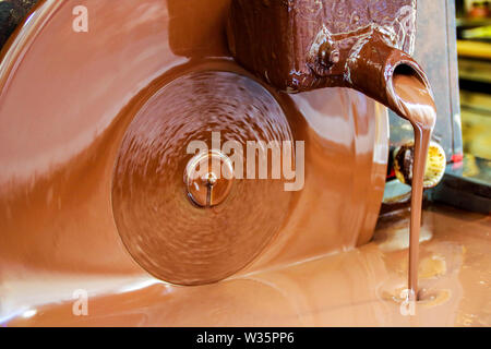 liquid chocolate in a chocolate artisan shop Stock Photo