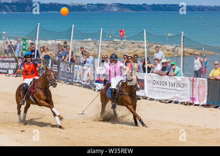 Sandbanks, Poole, Dorset, UK 12th July 2019. The Sandpolo British Beach Polo Championships gets underway at Sandbanks beach, Poole on a warm sunny day. The largest beach polo event in the world, the two day event takes place on Friday and Saturday, as visitors head to the beach to see the action. Credit: Carolyn Jenkins/Alamy Live News Stock Photo