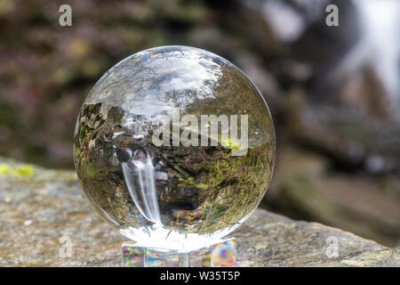 Crystal ball view of Melincourt Water Fall in full February flow, landscape. Stock Photo