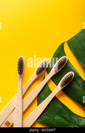 A family set of four wooden bamboo toothbrushes Stock Photo