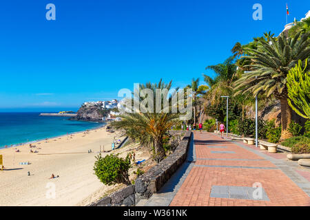 Beach in Morro del Jable town (Morro Jable beach) on Fuerteventura island, Canary Islands, Spain. One of the best beach in the Canaries. Fine yellow s Stock Photo
