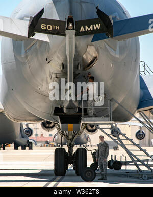 U.S. Air Force Airmen assigned to the 660th Aircraft Maintenance Squadron, work on the boom of a KC-10 Extender July 11, 2019, at Travis Air Force Base, California. The 660th AMXS provides combat-ready maintenance personnel and organizational support to inspect, service, and repair all transit and assigned KC-10A aircraft. (U.S. Air Force photo by Heide Couch) Stock Photo