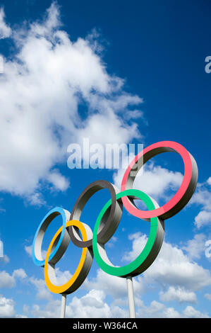 LONDON - APRIL, 2019: A large set of Olympic Rings stand under bright ...