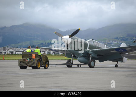 CHRISTCURCH, NEW ZEALAND, DECEMBER 12, 2018: Engineers at the Air Force Museum shift a 1941 Kittyhawk to another hangar for safekeeping. Stock Photo