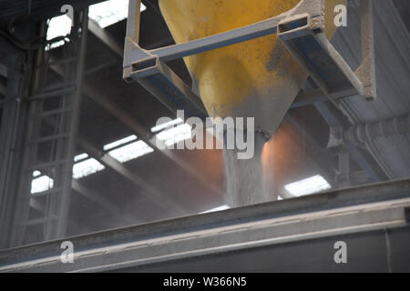 CHRISTCURCH, NEW ZEALAND, DECEMBER 12, 2018: Detail of the loading nozzle as a tip truck loads up with bulk fertiliser Stock Photo