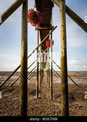 boardwalk made of wood during low tide on a beach near La Rochelle (France) Stock Photo
