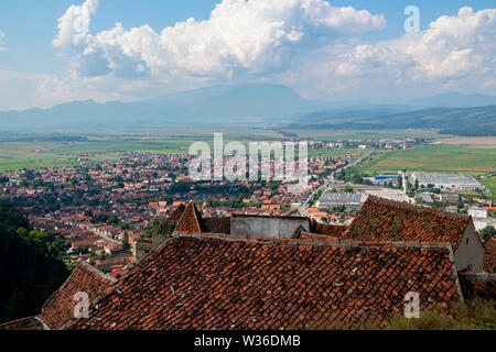 Brasov, Romania - August 20th, 2018: A panoramic view of the city and district of Brasov, Romania, as seen from the Rasnov castle. Stock Photo