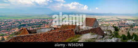 Brasov, Romania - August 20th, 2018: A panoramic view of the city and district of Brasov, Romania, as seen from the Rasnov castle. Stock Photo