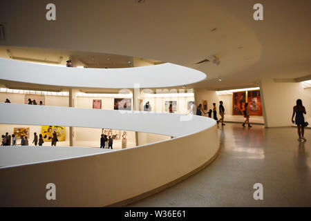 New York, USA. 12th July, 2019. People visit the Guggenheim Museum in New York, the United States, July 12, 2019. The Solomon R. Guggenheim Museum in New York City, often referred to as The Guggenheim, has been added to UNESCO's World Heritage List.    The museum is among eight buildings in the United States that were inscribed on the list under the title of The 20th-Century Architecture of Frank Lloyd Wright. The announcement was made during the 43rd Session of the World Heritage Committee held in Baku, Azerbaijan from June 30 to July 10. Credit: Xinhua/Alamy Live News Stock Photo