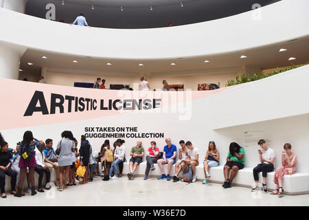 New York, USA. 12th July, 2019. Visitors rest at the Guggenheim Museum in New York, the United States, July 12, 2019. The Solomon R. Guggenheim Museum in New York City, often referred to as The Guggenheim, has been added to UNESCO's World Heritage List.    The museum is among eight buildings in the United States that were inscribed on the list under the title of The 20th-Century Architecture of Frank Lloyd Wright. The announcement was made during the 43rd Session of the World Heritage Committee held in Baku, Azerbaijan from June 30 to July 10. Credit: Xinhua/Alamy Live News Stock Photo