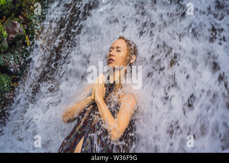 Young woman tourist in Holy springs Sebatu in Bali Stock Photo