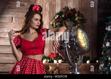 girl in red Mickey costume on holiday Stock Photo