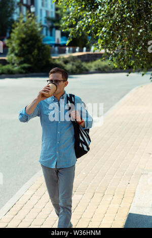 Man drinking coffee while going to work in the morning Stock Photo