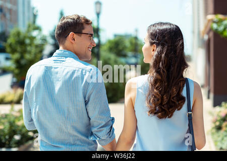 Happy man looking at his beautiful young wife Stock Photo
