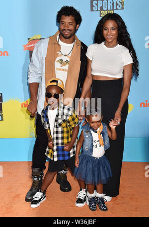 SANTA MONICA, CA - JULY 11: (L-R) Russell Wilson, Ciara, Future Zahir Wilburn and Sienna Princess Wilson attend Nickelodeon Kids' Choice Sports 2019 at Barker Hangar on July 11, 2019 in Santa Monica, California. Stock Photo