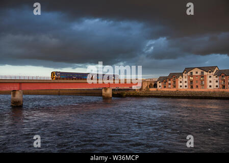 Abellio Scotrail class 158 sprinter train 158714 crossing the Ness Viaduct, Inverness with a train to the far north line Stock Photo