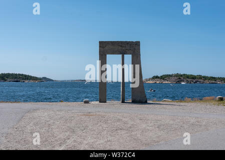 Strömstad, Sweden - July 11, 2019: View of a stone gate in Strömstad directly at the sea, western Sweden. Stock Photo