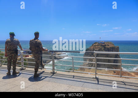 Beirut, Lebanon. 13th July 2019. Lebanese soldiers watch contestants dive from the 100 metre high  Pigeon Rocks Roauche as they take part in the Red Bull World Diving Championships from 13-14 July.Credit: amer ghazzal/Alamy Live News Stock Photo