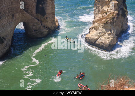 Beirut, Lebanon. 13th July 2019.  Safety dinghings pick up  divers from the 100 metre high  Pigeon Rocks Roauche in the Red Bull World Diving Championships from 13-14 July.Credit: amer ghazzal/Alamy Live News Stock Photo