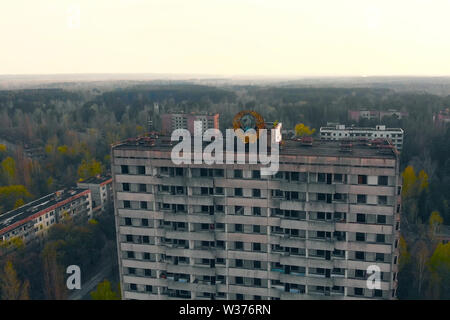 Soviet coat of arms on a building in Pripyat Stock Photo