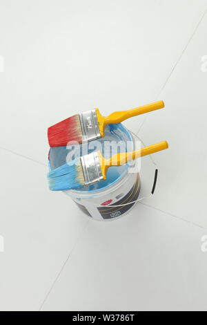 High angle view of open paint can with paintbrushes Stock Photo