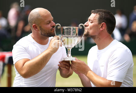 Stefan Olsson and Joachim Gerard following their victory in the men's wheelchair doubles final on day twelve of the Wimbledon Championships at the All England Lawn Tennis and Croquet Club, Wimbledon. Stock Photo