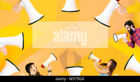 people shouting into a megaphone, attention concept announcement Stock Photo