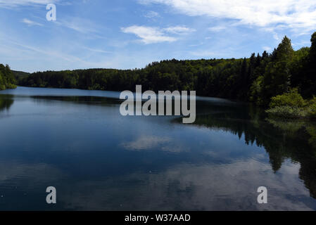 Remscheid, Germany. 10th July, 2019. The Eschbach dam, which was opened in 1891, is the first drinking water dam in Germany and the Eschbach is dammed. Credit: Horst Ossinger//dpa/Alamy Live News Stock Photo