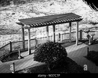 Gulf Shores, AL USA - 05/08/2019  -  Swings By The Beach in B&W Stock Photo