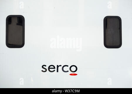 Close-up of a Serco Group plc signage and prisoner transport van Stock Photo