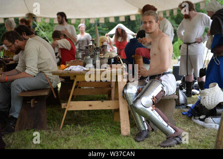 Medieval re-renactors attend the Tewkesbury Medieval Festival at Tewkesbury Battlefield in Gloucestershire. Stock Photo