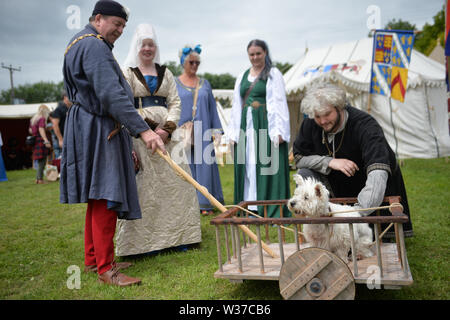 Medieval re-renactors attend the Tewkesbury Medieval Festival at Tewkesbury Battlefield in Gloucestershire. Stock Photo