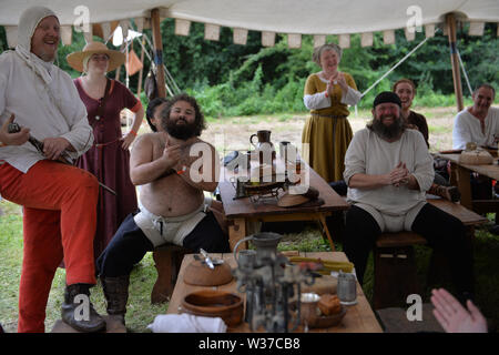 Medieval re-renactors attend the Tewkesbury Medieval Festival at Tewkesbury Battlefield in Gloucestershire. Stock Photo