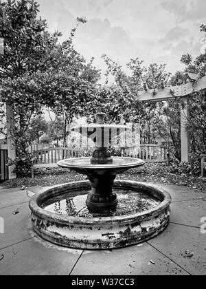 Gulf Shores, AL USA - 05/11/2019  -  Water Fountain by the Path 4 in B&W Stock Photo