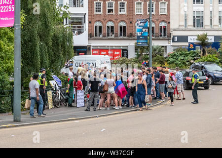 Bournemouth, UK. 13th July, 2019. A Christian street preacher uses an amplifier to talk about sin, but is drowned out by over 100 LGBT pride protestors in the centre of Bournemouth. Credit: Thomas Faull/Alamy Live News Stock Photo