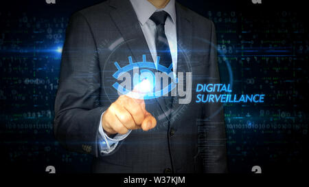 A businessman in a suit and screen with cyber eye hologram. Man using hand on virtual display interface. Digital surveillance, spying, hacking and vio Stock Photo