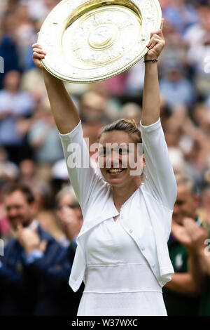 London, UK, 13th July 2019: Simona Halep from Romania celebrates her 1st Wimbledon victory at day 12 of the Wimbledon Tennis Championships at All England Lawn Tennis and Croquet Club. Credit: Frank Molter/Alamy Live news Stock Photo