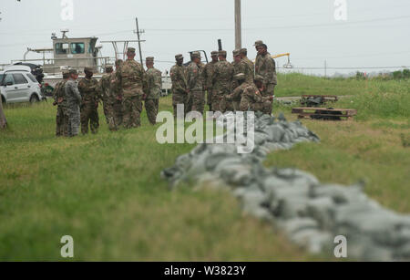 Army National Guard soldiers of the 2225 Multi-role Bridge Company fill sandbags at a Marina near and do other prep work.New Orleans and other parts of the Gulf of Mexico prepare for the Tropical Storm Barry to make landfall, bringing with it a catastrophic rainfall. With the Mississippi River's water level at an all-time high and a storm forming in the Gulf of Mexico that is expected to make landfall on the Louisiana and Texas coasts, many fear that levees will fail and that New Orleans will again be inundated as bad as it was in the 2004 aftermath of Hurricane Kartina. Stock Photo