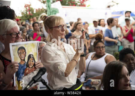 Atlanta, Georgia, USA. 12th July, 2019. Hundreds of people gathered at Plaza Fiesta in Atlanta to protest against immigration detention camps and the separation of children from their families by the U.S. government. The Lights for Liberty rally was part of a nation-wide series of events organized by the New Sanctuary Movement. Credit: Steve Eberhardt/ZUMA Wire/Alamy Live News Stock Photo