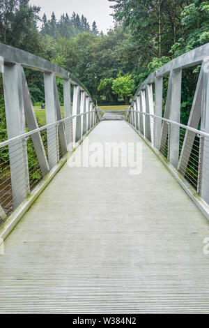 A walking bridge gives access to Maplewood Park in Renton, Washington. Stock Photo