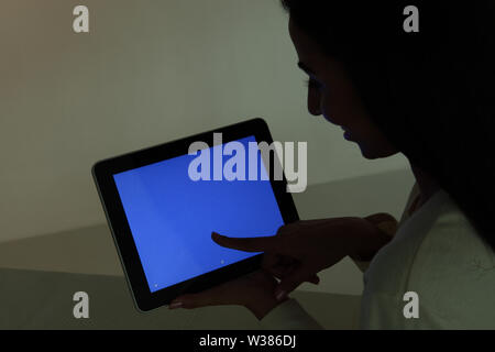 Woman using a digital tablet Stock Photo