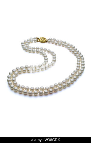 Double strand white pearl necklace with gold clasp. Set on a white background with a shadow under the pearls.
