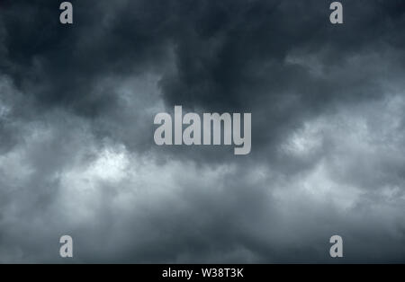 Dark and gloomy clouds signalling the impending arrival of a storm Stock Photo