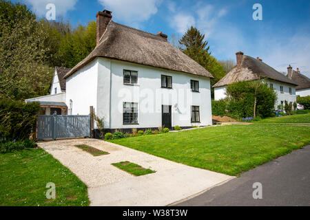 Thatched houses in the village of Milton Abbas, Dorset, England, UK Stock Photo