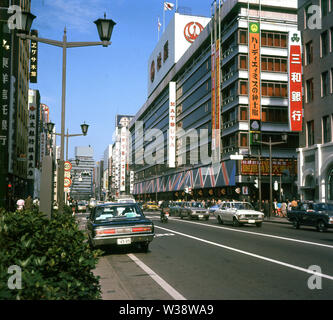 1960s, historical, city street scene, Tokyo, Japan. A sign, in English, for Matsuya, a Japanese restaurant can be seen on the main building. Stock Photo