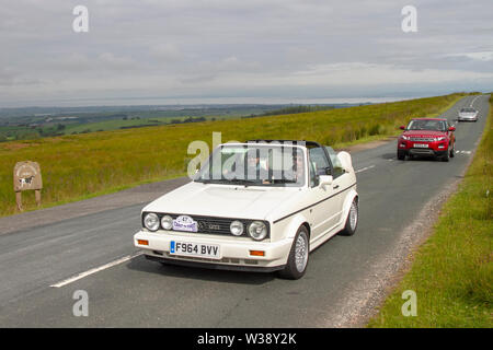 1989 90s nineties Volkswagen Golf Cabrio GTI. Vintage, classic, collectable, heritage, historics vehicles left Morecambe heading for a cross county journey over the Lancashire landscape to Whitby. A 170 mile trek over undulating landscape as part of the classics on tour car club annual event. Stock Photo