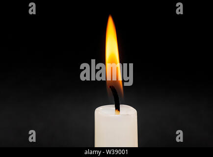 Candle Flame Fire isolated on Black Background with Soft Smoke Stock Photo