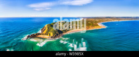 Byron bay and famous lighthouse on the top of headland facing Pacific ocean - the most eastern part of Australian continent. Stock Photo